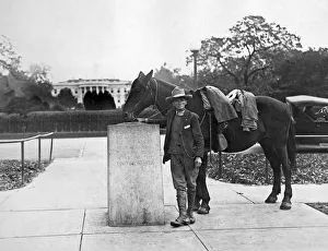 <b class=qtipBold><figcaption>Man Rides Through Every State</figcaption></b><br>Washington, D.C.: November 4, 1927. On April 1, 1925, Frank Heath of Silver Springs, Maryland, began a horseback tour of every state in the Union. Today he finished his ride, having ridden the same horse for 11, 387 miles. Here he is at the Zero Milestone in front of the White House.<br><em>© Underwood Archives/UIG</em> Man Rides Through Every State