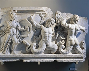 Marble relief depicting Battle of Gods and Giants, detail of goddess Artemis and half human, half snake deity Marble relief depicting Battle of Gods and Giants, detail of goddess Artemis and half human, half snake deity