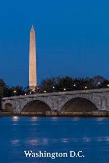 Memorial Bridge at dusk spans Potomac River and features Washington Monument Memorial Bridge at dusk spans Potomac River and features Washington Monument