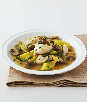 Monkfish, courgette and mushroom stew in white wine sauce Monkfish, courgette and mushroom stew in white wine sauce
