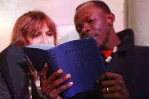 Multiracial couple reading the bible Multiracial couple reading the bible