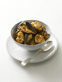 Mussels and monkfish in cup, close-up Mussels and monkfish in cup, close-up