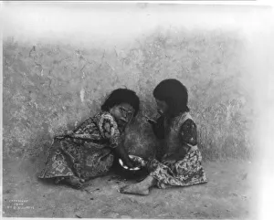 Native American Hopi children eating a melon, c1903