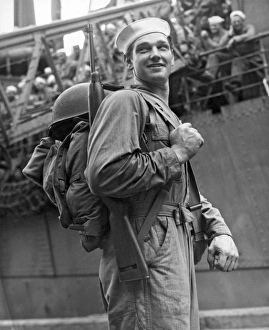 <b class=qtipBold><figcaption>Navy Seabee Off To War</figcaption></b><br>Davisville, Rhode Island: December 26, 1943. This Navy Seabee is heading off for duty in the South Pacific. The Seabees were founded here two years ago on December 28, 1941, ready to work or fight or both.<br><em>© Underwood Archives/UIG</em> Navy Seabee Off To War