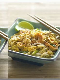 Pad thai, rice noodle dish made with tofu, shrimps, peanuts, vegetables, seasoned with tamarind and lime