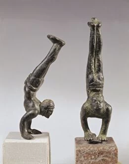 Pair of bronze statuettes of black acrobats walking on their hands, From Volubilis (Morocco)
