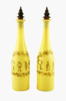 Pair of Richardson's yellow glass decanters, with silver gilt stoppers, decorated Pair of Richardson's yellow glass decanters, with silver gilt stoppers, decorated