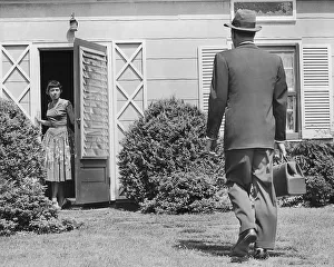 Physician walks towards home for house call Physician walks towards home for house call