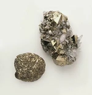 A piece of octahedral pyrite interspersed with quartz crystals, and a piece nodular pyrite, close-up
