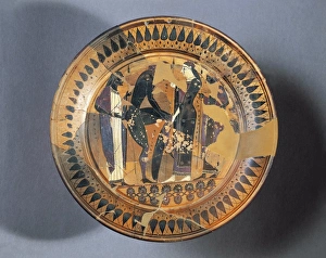 Plate depicting Achilles wearing armor forged by Hephaestus and given to him by Thetis, by painter Lydos Plate depicting Achilles wearing armor forged by Hephaestus and given to him by Thetis, by painter Lydos