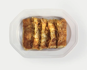 Plate of Murtabak, fried egg pancakes stuffed with meat, a typical dish from Singapore Plate of Murtabak, fried egg pancakes stuffed with meat, a typical dish from Singapore