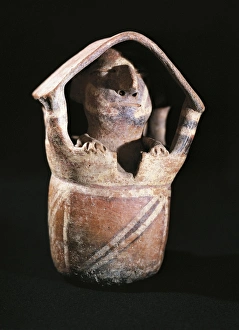 Polychrome terracotta vessel in shape of a house with a man inside, Peru, Vicus culture Polychrome terracotta vessel in shape of a house with a man inside, Peru, Vicus culture