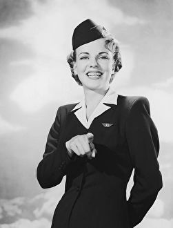 <b class=qtipBold><figcaption>Portrait of stewardess pointing</figcaption></b> Portrait of stewardess pointing