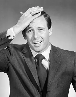 Images Dated 17th July 2003: Portrait of surprised man with hand on head