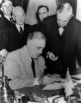 President Franklin Roosevelt signing the United states declaration of war against Germany President Franklin Roosevelt signing the United states declaration of war against Germany