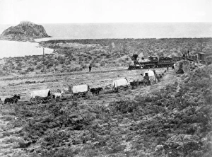 <b class=qtipBold><figcaption>Railroad Meets Wagon Train</figcaption></b><br>Monument Point, Utah: c. 1868 The Central Pacific Railroad's Jupiter engine passes by a wagon train during the construction of the transcontinental railroad on the north side of the Great Salt Lake.<br><em>© Underwood Archives/UIG</em> Railroad Meets Wagon Train