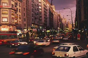 Rear, blurred view of the tail-lights of cars in a congested Spanish city at nightfall Rear, blurred view of the tail-lights of cars in a congested Spanish city at nightfall