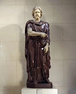 Red porphyry and marble statue of Barbarian prisoner from Rome Red porphyry and marble statue of Barbarian prisoner from Rome
