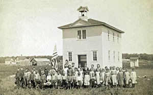 <b class=qtipBold><figcaption>One Room Schoolhouse</figcaption></b><br>United States: c. 1890. A one room schoolhouse in the prairie with the class and teacher out front for their portrait.<br><em>© Underwood Archives/UIG</em> One Room Schoolhouse