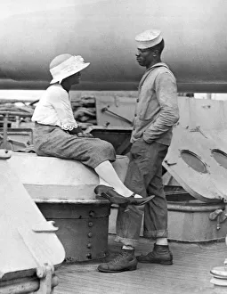 <b class=qtipBold><figcaption>A Sailor Receives Company</figcaption></b><br>New York, New York: August 3, 1922. A sailor on the U.S.S. Wyoming receives company as the Atlantic Fleet comes home.<br><em>© Underwood Archives/UIG</em> A Sailor Receives Company