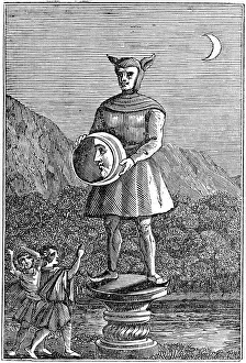 Saxon idol of the Moon shown holding a disc which displays the phases of the Moon Saxon idol of the Moon shown holding a disc which displays the phases of the Moon