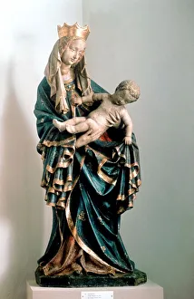 Schone Madonna Virgin Mary holding the baby Jesus. Painted statue, Pfarrkirche Schone Madonna Virgin Mary holding the baby Jesus. Painted statue, Pfarrkirche
