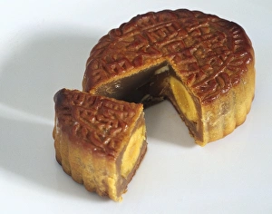 Singaporean mooncake, with a quarter section removed, showing the duck egg filling Singaporean mooncake, with a quarter section removed, showing the duck egg filling