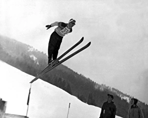 <b class=qtipBold><figcaption>Ski Jumper Takes To The Air</figcaption></b><br>United States: c. 1957. A ski jumper goes airborne in this wintry scene.<br><em>© Underwood Archives/UIG</em> Ski Jumper Takes To The Air