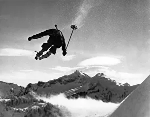 <b class=qtipBold><figcaption>Skiing Over Mt. Ranier</figcaption></b><br>Mount Rainier, Washington: January 5, 1935. Hans Grage, an Olympic hopeful, appears to be jumping right over Mt. Rainier in this dramatic photo.<br><em>© Underwood Archives/UIG</em> Skiing Over Mt. Ranier