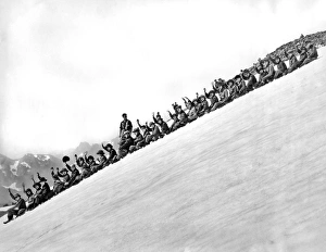 <b class=qtipBold><figcaption>Sliding Down Mt. Rainier</figcaption></b><br>Rainier National Park, Washington: c. 1930. One of the main summer snow amusements at Rainier National Park. The participants are given tin breeches for their thrilling ride down the mountain.<br><em>© Underwood Archives/UIG</em> Sliding Down Mt. Rainier