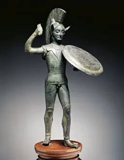 Small bronze votive statue representing a warrior (or perhaps Mars) Small bronze votive statue representing a warrior (or perhaps Mars)