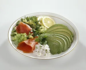 Smoked trout and avocados served with salad leaves, seafood dip and lemon slices Smoked trout and avocados served with salad leaves, seafood dip and lemon slices