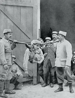The Snake Man: A contortionist entertaining his fellow French soldiers by performing The Snake Man: A contortionist entertaining his fellow French soldiers by performing