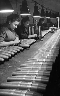 Soviet artillery shells undergoing quality control inspection by civilian women workers Soviet artillery shells undergoing quality control inspection by civilian women workers