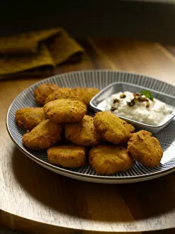 Spicy lentils fritters with coconut chutney, close-up
