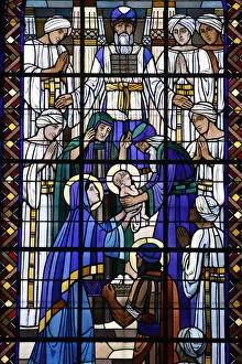Stained glass in Notre Dame du Rosaire catholic church: Jesus presented at the temple Stained glass in Notre Dame du Rosaire catholic church: Jesus presented at the temple