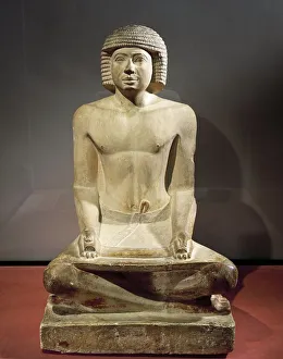 Statue of a scribe sitting with papyrus on his knees, painted limestone Statue of a scribe sitting with papyrus on his knees, painted limestone