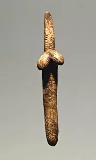 Stylized female figure in bone, from Dolni Vestonice