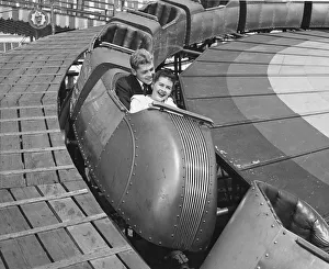 Teenage couple on roller coaster, Coney Island, New York, 1950s, black and white Teenage couple on roller coaster, Coney Island, New York, 1950s, black and white