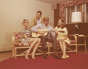 <b class=qtipBold><figcaption>Teenagers enjoying guitar music</figcaption></b> Teenagers enjoying guitar music