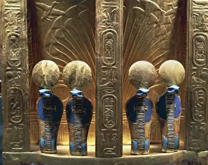 Treasure of Tutankhamen. Throne of Tutankhamen. Detail, four uraei crowned with sun discs Treasure of Tutankhamen. Throne of Tutankhamen. Detail, four uraei crowned with sun discs