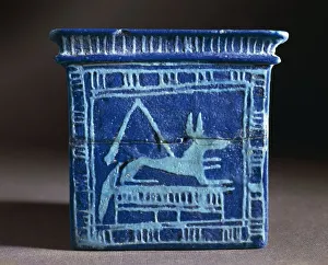 Turquoise enamelled clay pectoral pendant in the shape of a naos, decorated with god Anubis as a jackal Turquoise enamelled clay pectoral pendant in the shape of a naos, decorated with god Anubis as a jackal