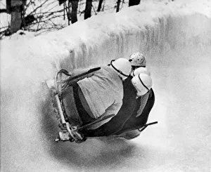 <b class=qtipBold><figcaption>The USA Bobsled Team On A Run</figcaption></b><br>Lake Placid, New York: February 14, 1961 The USA Bobsled team, lead by Fred Fortune, negotiates a tough corner along the slopes of Mt. Van Howevenberg at Lake Placid, enroute to the 1961 World Bobsled Championship.<br><em>© Underwood Archives/UIG</em> The USA Bobsled Team On A Run