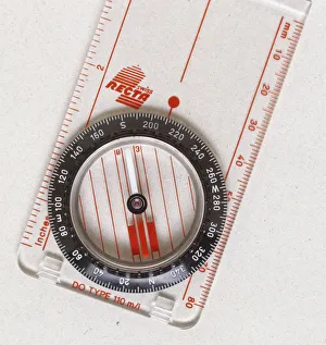 Above view of a magnetic compass the needle always points north Above view of a magnetic compass the needle always points north