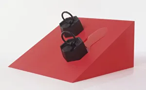 Two weights sliding down sloping surface one with oil showing reduction in friction using Two weights sliding down sloping surface one with oil showing reduction in friction using