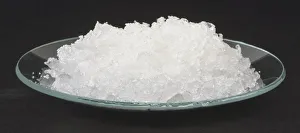 White crystals of sodium carbonate decahydrate, washing soda, in watch glass White crystals of sodium carbonate decahydrate, washing soda, in watch glass