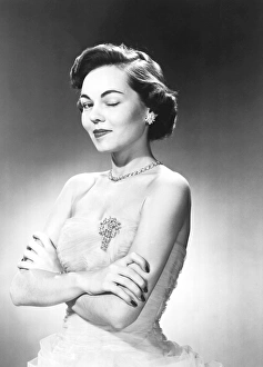 Woman in evening wear winking her eye Woman in evening wear winking her eye