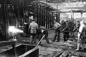 Workers of the krasny oktyabr iron and steel works back at work at the restored plant in Workers of the krasny oktyabr iron and steel works back at work at the restored plant in