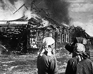World war 2, soviet women watch as their homes burn with fire set by retreating germans World war 2, soviet women watch as their homes burn with fire set by retreating germans