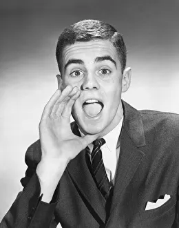 <b class=qtipBold><figcaption>Young businessman yelling out</figcaption></b> Young businessman yelling out